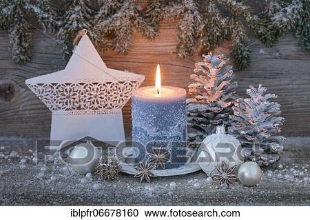 Stock Image - Natural Advent decoration with candle. Fotosearch