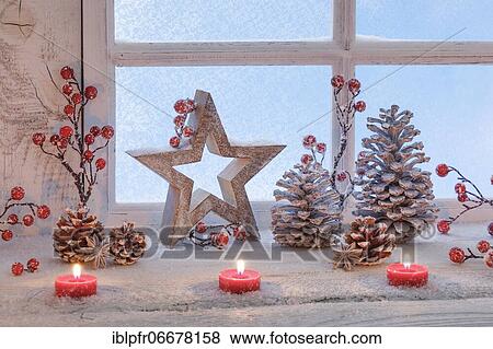 Stock Photo - Natural Advent decoration with candles. Fotosearch