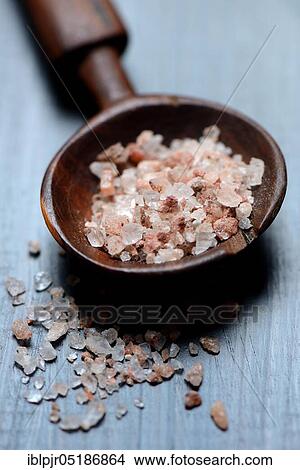 Picture - Natural salt in wooden spoon. Fotosearch
