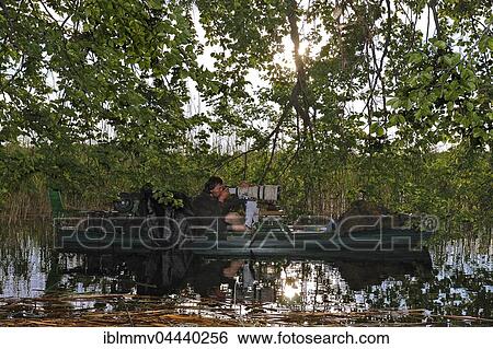 Nature photographer on boat, Müritz National Park, Mecklenburg-Western Pomerania, Germany, Europe View Large Photo Image Stock Photograph - Nature photographer on boat, Müritz National Park, Mecklenburg-Western Pomerania, Germany, Europe. Fotosearch