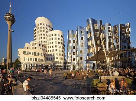 Stock Photography - Neuer Zollhof with Gehry buildings and the Rhine Tower, Düsseldorf, North Rhine-Westphalia, Germany, Europe. Fotosearch