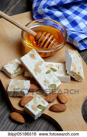 Nougat de Montelimar with almonds and honey View Large Photo Image Stock Photograph - Nougat de Montelimar with almonds and honey. Fotosearch