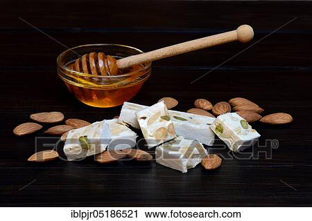 Stock Image - Nougat with almonds and honey, Nougat de Montelimar. Fotosearch