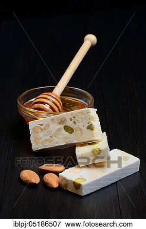 Stock Photo - Nougat with almonds and honey, Nougat de Montelimar. Fotosearch