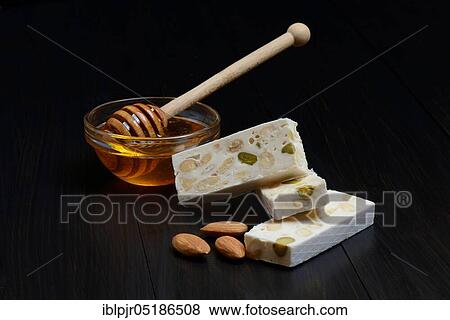 Nougat with almonds and honey, Nougat de Montelimar View Large Photo Image Stock Photo - Nougat with almonds and honey, Nougat de Montelimar. Fotosearch