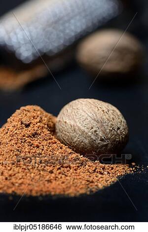 Nutmegs and nutmeg powder, ground, grated View Large Photo Image Stock Photograph - Nutmegs and nutmeg powder, ground, grated. Fotosearch