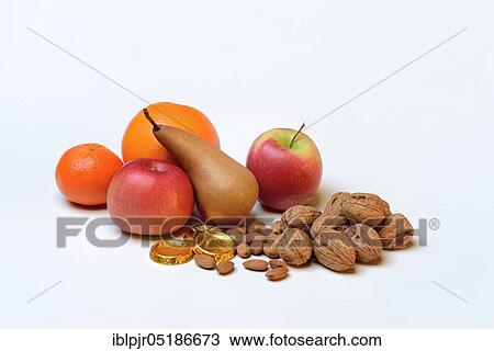 Nuts and fruits for St. Nicholas Day, almonds, apples, pears, orange, tangerine, gold coins, chocolate coins View Large Photo Image Stock Image - Nuts and fruits for St. Nicholas Day, almonds, apples, pears, orange, tangerine, gold coins, chocolate coins. Fotosearch