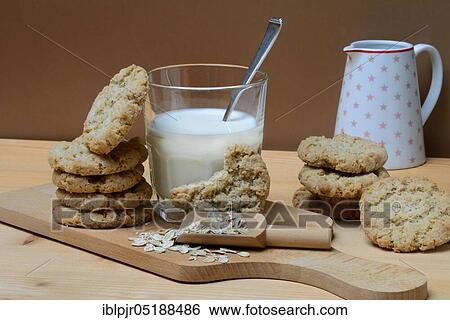 Oatmeal biscuits, oatmeal in scoop, glass of milk, oatmeal biscuits, oatmeal cookie View Large Photo Image Stock Photograph - Oatmeal biscuits, oatmeal in scoop, glass of milk, oatmeal biscuits, oatmeal cookie. Fotosearch
