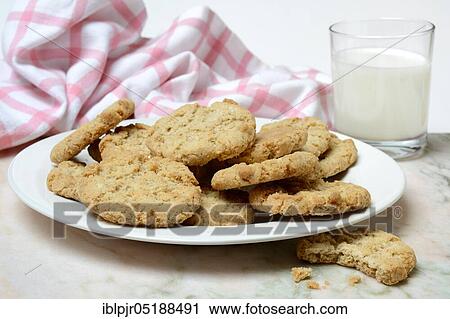 Oatmeal biscuits on plate and glass of milk View Large Photo Image Stock Image - Oatmeal biscuits on plate and glass of milk. Fotosearch