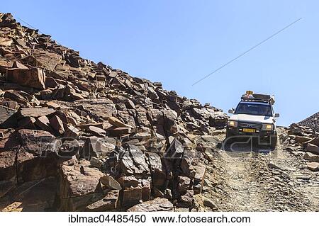 Off-road vehicle in Divorce Pass, Damaraland, Kunene Region, Namibia, Africa View Large Photo Image Stock Image - Off-road vehicle in Divorce Pass, Damaraland, Kunene Region, Namibia, Africa. Fotosearch