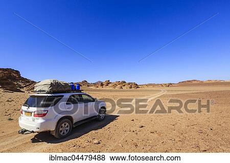 Off road vehicle in rock desert, Damaraland, Kunene Region, Namibia, Africa View Large Photo Image Stock Photo - Off road vehicle in rock desert, Damaraland, Kunene Region, Namibia, Africa. Fotosearch
