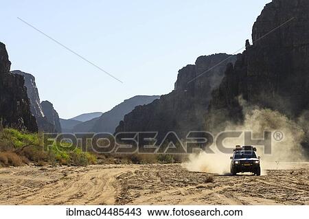 Off-road vehicle in the Ugab riverbed, Damaraland, Kunene Region, Namibia, Africa View Large Photo Image Stock Image - Off-road vehicle in the Ugab riverbed, Damaraland, Kunene Region, Namibia, Africa. Fotosearch