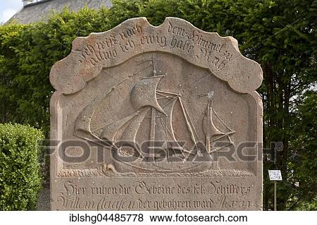 Stock Photo - Old grave stone with Sailboat on cemetery, Nebel, Amrum, North Frisia, Schleswig-Holstein, Germany, Europe. Fotosearch