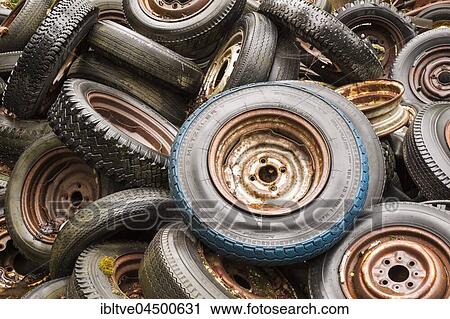 Old, rusty car tires, car scrap yard, Bastnäs, Varmland, Sweden, Europe View Large Photo Image Stock Image - Old, rusty car tires, car scrap yard, Bastnäs, Varmland, Sweden, Europe. Fotosearch