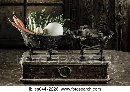 Old scales with egg, carrots, lettuce and weights View Large Photo Image Stock Photograph - Old scales with egg, carrots, lettuce and weights. Fotosearch