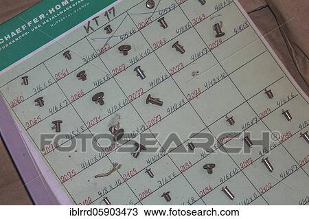 Old sheet with patterns of different rivets, button factory, industry, lost place, Wuppertal, North Rhine-Westphalia, Germany, Europe View Large Photo Image Stock Image - Old sheet with patterns of different rivets, button factory, industry, lost place, Wuppertal, North Rhine-Westphalia, Germany, Europe. Fotosearch
