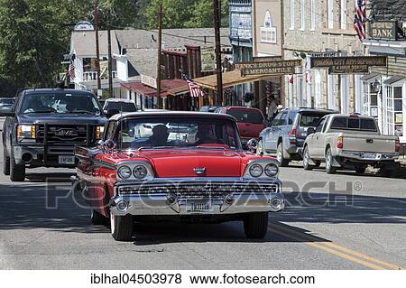 Oldtimer driving through Virginia City, former gold mining town, Montana Province, USA, North America View Large Photo Image Stock Photo - Oldtimer driving through Virginia City, former gold mining town, Montana Province, USA, North America. Fotosearch