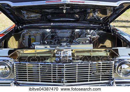 Open bonnet of an old Chevrolet, Power Meet vintage car rally, Västerås, Sweden, Europe View Large Photo Image Stock Image - Open bonnet of an old Chevrolet, Power Meet vintage car rally, Västerås, Sweden, Europe. Fotosearch