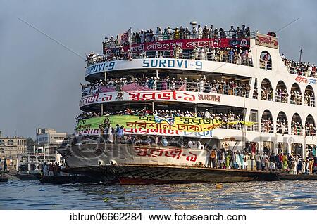Overloaded passenger ferry with pilgrims on the Dhaka river, Port of Dhaka, Dhaka, Bangladesh, Asia View Large Photo Image Picture - Overloaded passenger ferry with pilgrims on the Dhaka river, Port of Dhaka, Dhaka, Bangladesh, Asia. Fotosearch