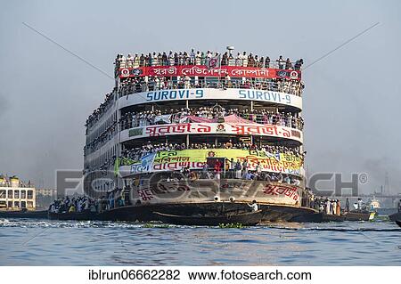 Overloaded passenger ferry with pilgrims on the Dhaka river, Port of Dhaka, Dhaka, Bangladesh, Asia View Large Photo Image Stock Image - Overloaded passenger ferry with pilgrims on the Dhaka river, Port of Dhaka, Dhaka, Bangladesh, Asia. Fotosearch