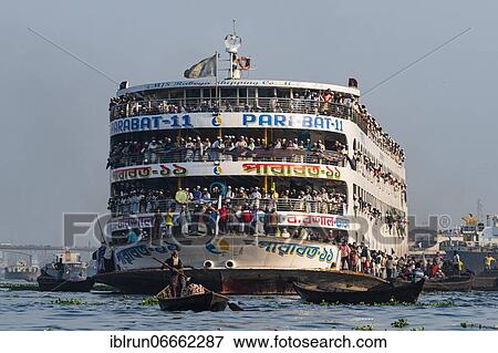 Stock Photo - Overloaded passenger ferry with pilgrims on the Dhaka river, Port of Dhaka, Dhaka, Bangladesh, Asia. Fotosearch