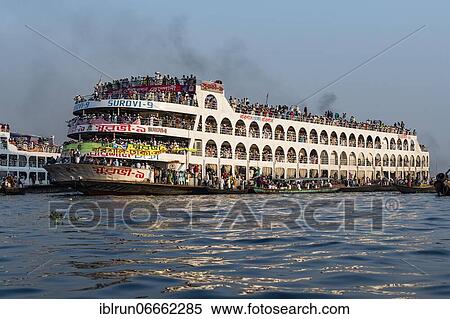 Overloaded passenger ferry with pilgrims on the Dhaka river, Port of Dhaka, Dhaka, Bangladesh, Asia View Large Photo Image Stock Photography - Overloaded passenger ferry with pilgrims on the Dhaka river, Port of Dhaka, Dhaka, Bangladesh, Asia. Fotosearch