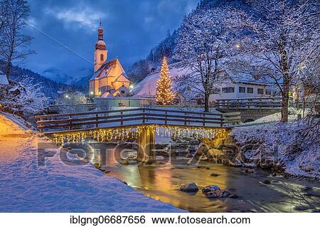 Stock Photograph - Painter's corner with Ramsauer Ache and parish church with Christmas fir tree, Ramsau, Berchtesgadener Land, Upper Bavaria, Bavaria, Germany, Europe. Fotosearch