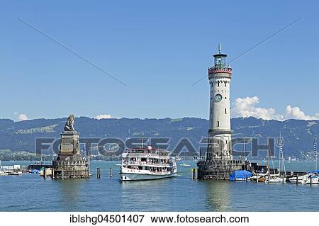 Passenger ship in port entrance with lighthouse in the harbor, Lindau, Lake Constance, Bavaria, Germany, Europe View Large Photo Image Stock Photo - Passenger ship in port entrance with lighthouse in the harbor, Lindau, Lake Constance, Bavaria, Germany, Europe. Fotosearch