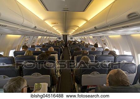 Passengers during a flight in airplane, Germany, Europe View Large Photo Image Stock Photo - Passengers during a flight in airplane, Germany, Europe. Fotosearch