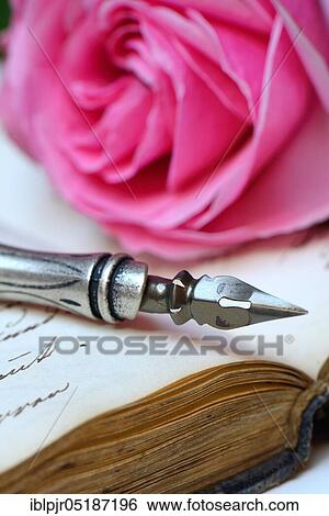 Pen and pencil with nib on book with old handwriting View Large Photo Image Stock Photograph - Pen and pencil with nib on book with old handwriting. Fotosearch