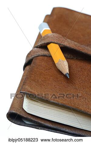 Stock Image - Pencil on notebook, diary, travel diary. Fotosearch