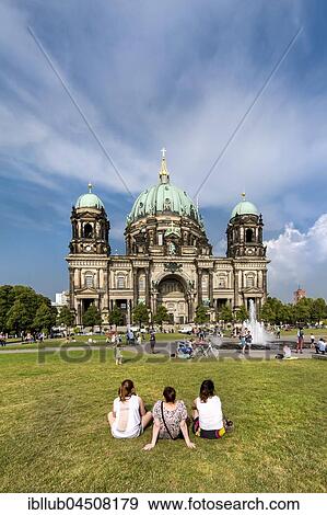 People sitting on lawn in front of the Cathedral, Museum Island, Berlin-Mitte, Berlin, Germany, Europe View Large Photo Image Stock Photo - People sitting on lawn in front of the Cathedral, Museum Island, Berlin-Mitte, Berlin, Germany, Europe. Fotosearch