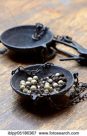 Peppercorns in weighing pan View Large Photo Image Stock Photo - Peppercorns in weighing pan. Fotosearch