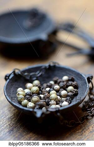 Peppercorns in weighing pan View Large Photo Image Stock Photograph - Peppercorns in weighing pan. Fotosearch