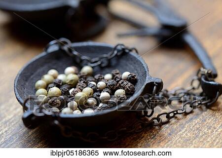 Stock Photography - Peppercorns in weighing pan. Fotosearch