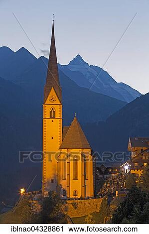 Pilgrimage church St. Vinzenz with Großglockner, evening mood, Heiligenblut, High Tauern National Park, Carinthia, Austria, Europe View Large Photo Image Stock Image - Pilgrimage church St. Vinzenz with Großglockner, evening mood, Heiligenblut, High Tauern National Park, Carinthia, Austria, Europe. Fotosearch