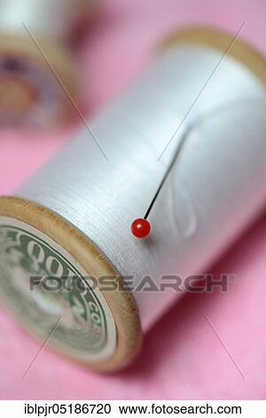 Stock Image - Pin and reel. Fotosearch