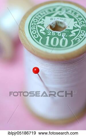 Stock Photo - Pin and reel. Fotosearch