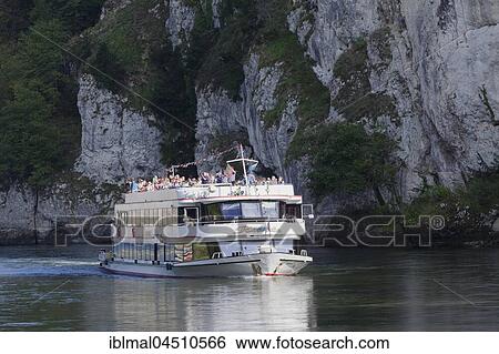 Stock Photograph - Pleasure boat on the Danube breakthrough, Danube near Kelheim, Lower Bavaria, Germany, Europe. Fotosearch