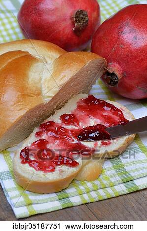 Pomegranate jelly on a slice of butter plait, pomegranates, Punica granatum View Large Photo Image Stock Image - Pomegranate jelly on a slice of butter plait, pomegranates, Punica granatum. Fotosearch