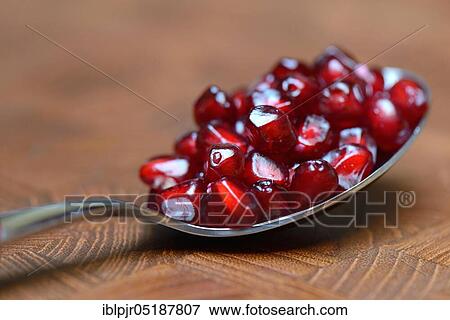 Pomegranate seeds on spoon, Punica granatum View Large Photo Image Stock Photo - Pomegranate seeds on spoon, Punica granatum. Fotosearch