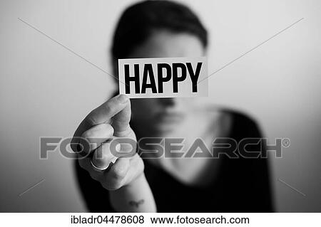 Portrait of a sad woman holding a card with inscription Happy View Large Photo Image Stock Photo - Portrait of a sad woman holding a card with inscription Happy. Fotosearch