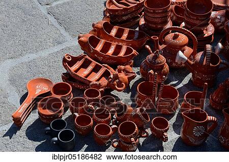 Stock Image - Portuguese pottery, earthenware, ceramics, ceramic tableware, street sale, pottery, Portugal, Europe. Fotosearch