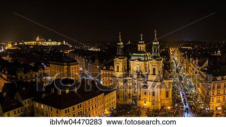 Prague's historic centre with Church of St. Nicholas at Old Town Square, view from Old Town Hall at night, Hradcany, Prague Castle and St. Vitus Cathedral at back, Prague, Czech Republic, Europe View Large Photo Image Stock Image - Prague's historic centre with Church of St. Nicholas at Old Town Square, view from Old Town Hall at night, Hradcany, Prague Castle and St. Vitus Cathedral at back, Prague, Czech Republic, Europe. Fotosearch