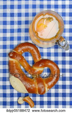 Stock Image - Pretzel, pretzel and glass of beer, pretzel pastry. Fotosearch