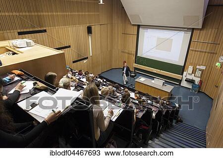 Stock Image - Professor and students during a lecture in the auditorium, Heinrich-Heine University, Düsseldorf, North Rhine-Westphalia, Germany, Europe. Fotosearch