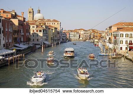 Public water buses and private water taxis on the Grand Canal, view from Ponte degli Scalzi, Venice, Veneto, Italy, Europe View Large Photo Image Picture - Public water buses and private water taxis on the Grand Canal, view from Ponte degli Scalzi, Venice, Veneto, Italy, Europe. Fotosearch