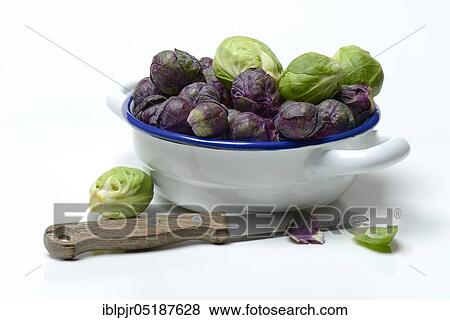 Stock Photo - Purple and green Brussels sprouts in a bowl. Fotosearch