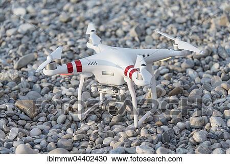 Stock Image - Quadcopter, drone with camera on ground, DJI Phantom 3. Fotosearch