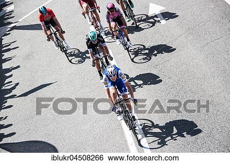 Stock Photograph - Racing cyclists with shadow, cycling race Volta de Catalunya, Catalunya Tour 2017, Barcelona, ​​Catalonia, Spain, Europe. Fotosearch